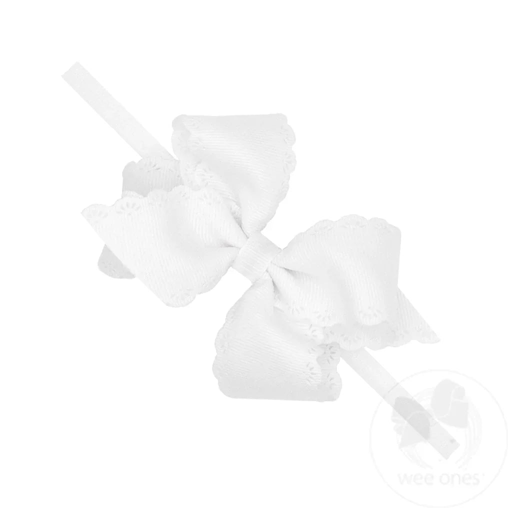 Small Grosgrain Hair Bow with Embossed Eyelet Edge on White Nylon Band